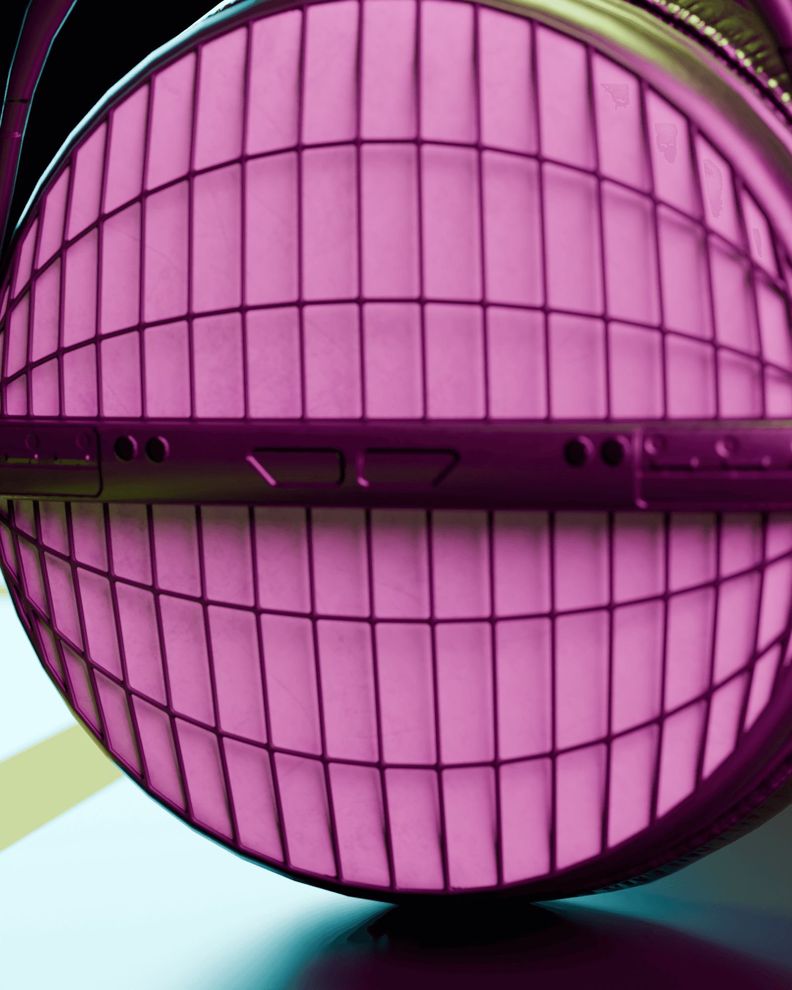 Detail of the open-mesh ear cup grille under magenta and cyan stage light