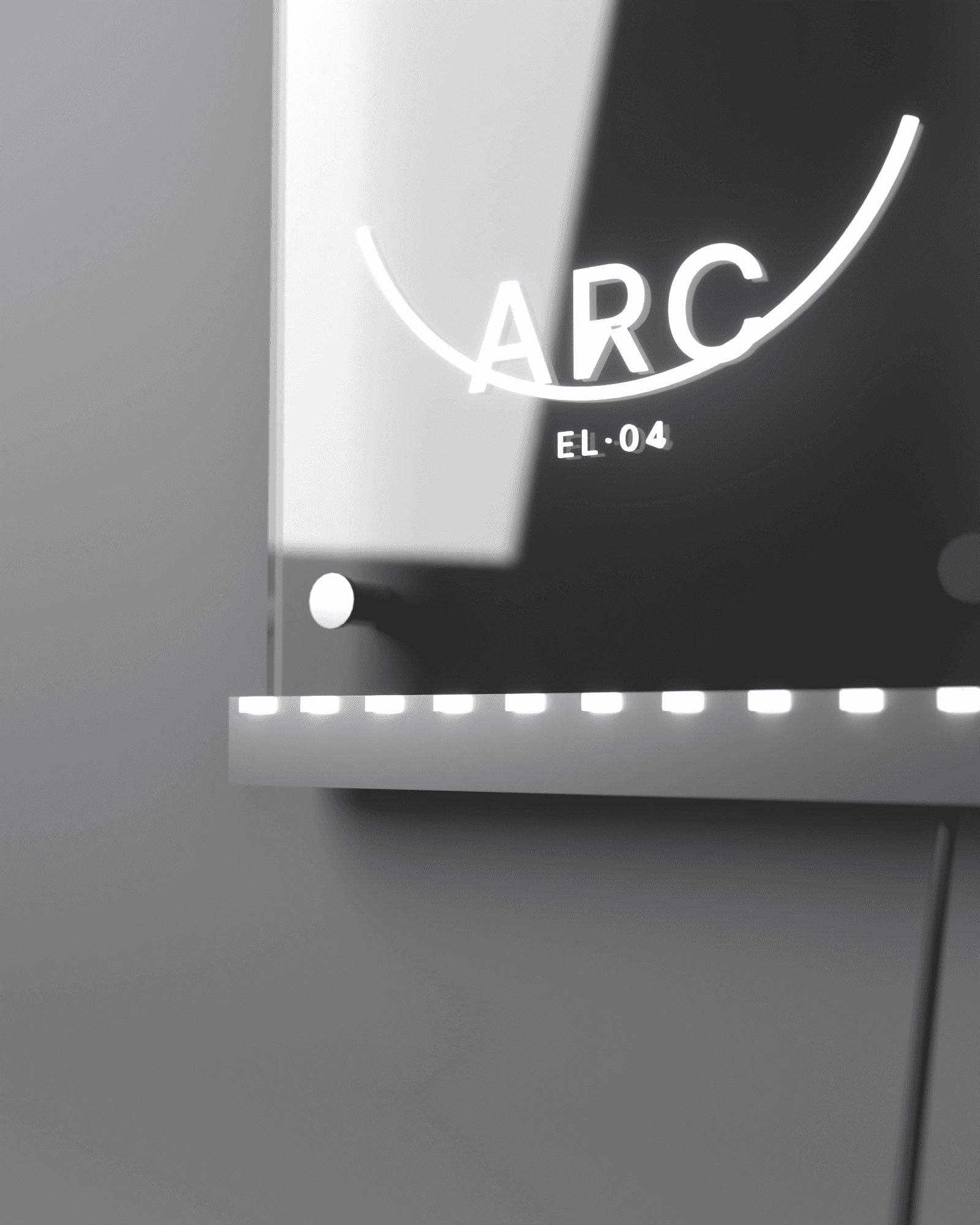 Macro detail of the ARC panel's bottom edge: discrete LED chips glowing along the brushed aluminum channel, a stainless standoff cap, the engraved arc and wordmark glowing out of focus behind the clear acrylic